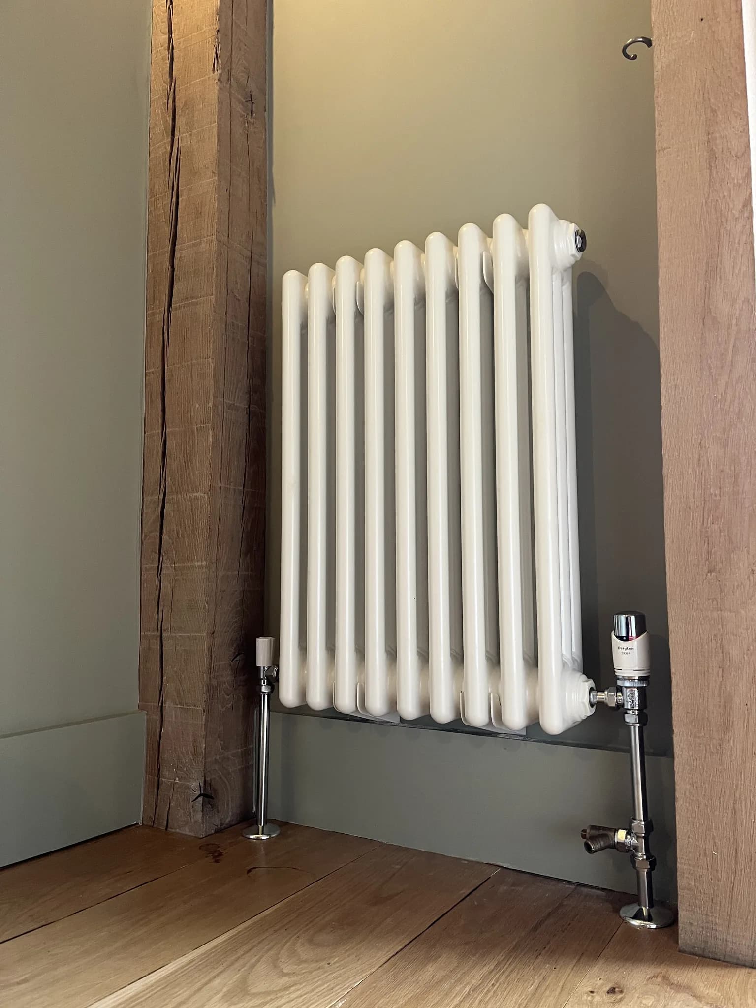 White column radiator fitted as part of a central heating service in Surrey